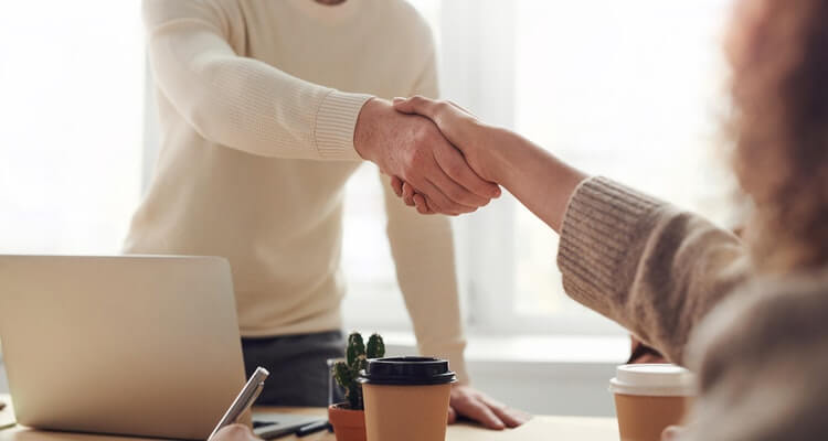Amazon business financing: shaking hands in agreement